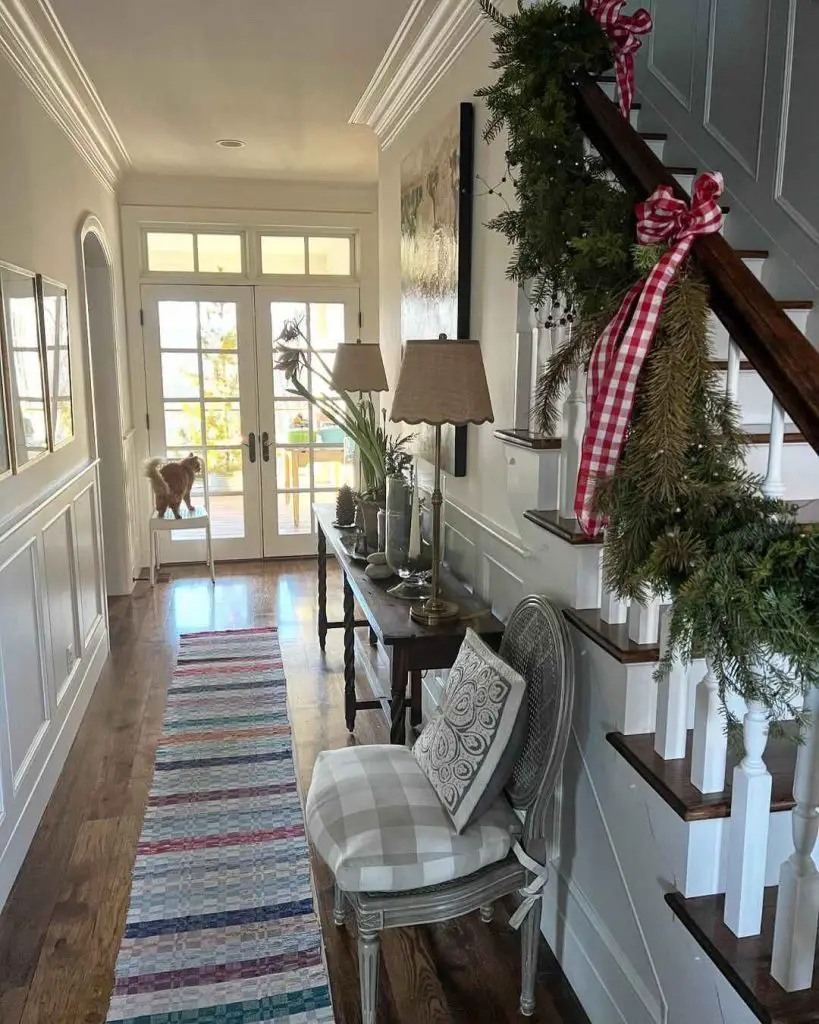 Cozy hallway decorated with greenery and holiday decor