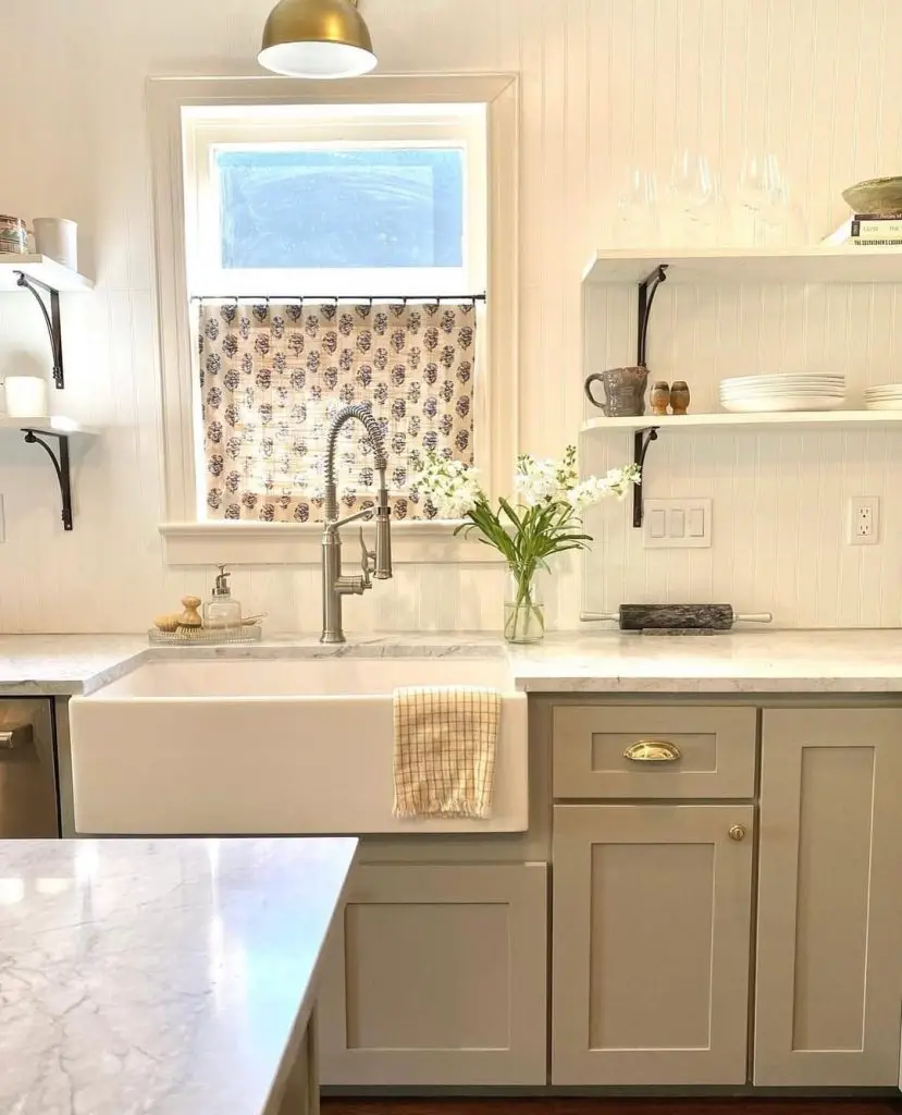 Cozy kitchen with farmhouse sink and marble countertops