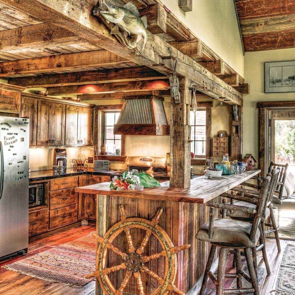 Rustic kitchen with alder cabinets and ship's wheel