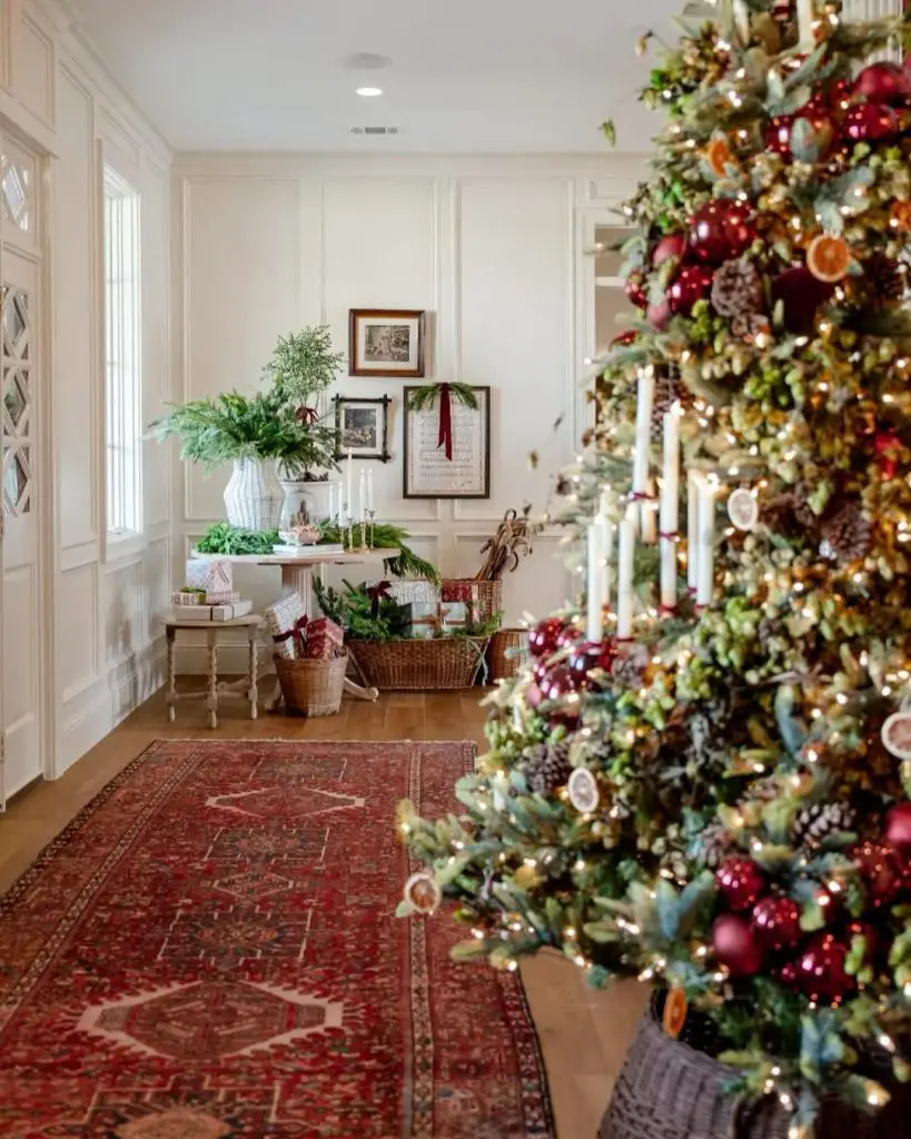 Elegant hallway featuring a decorated Christmas tree and a console table