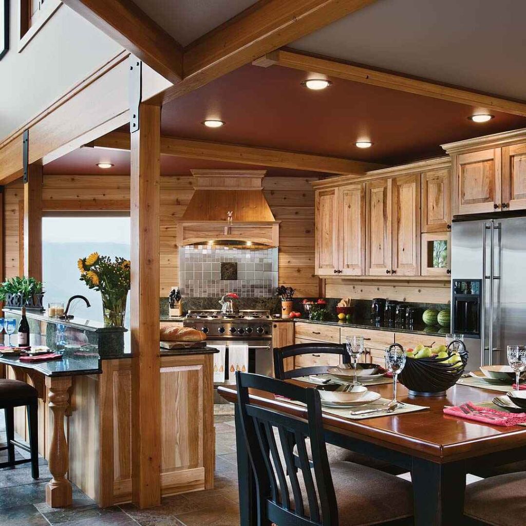 Elegant rustic kitchen with wooden cabinets, granite island, and open dining area