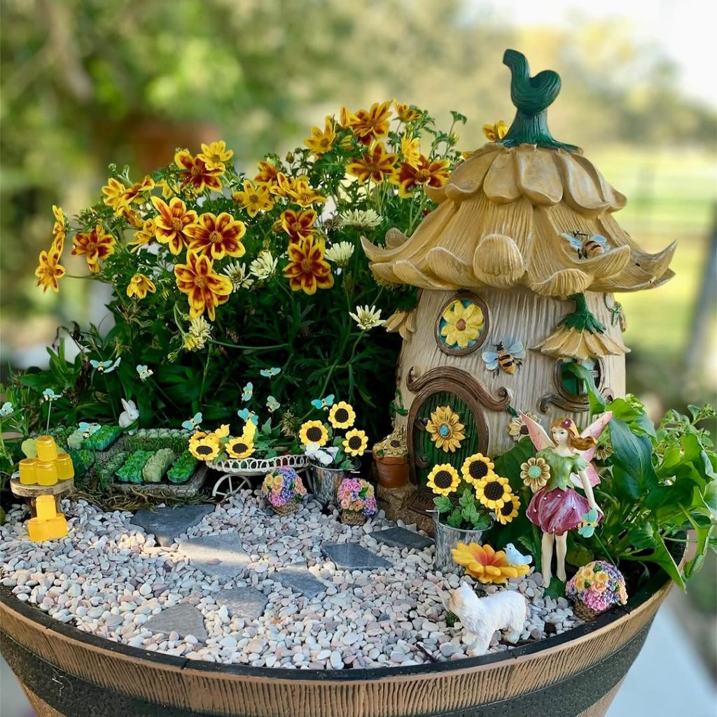 Whimsical fairy house surrounded by flowers and decorations