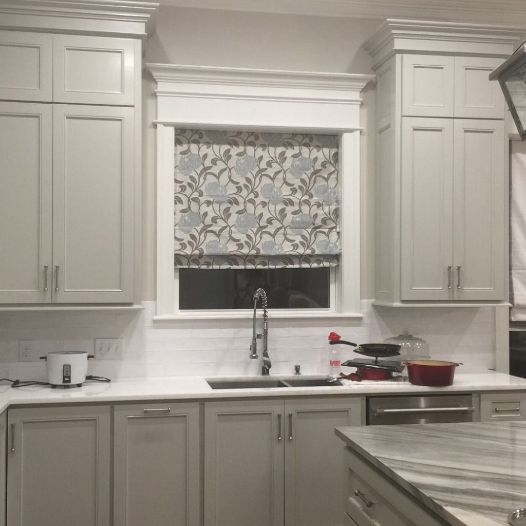 Floral Roman shade above kitchen sink