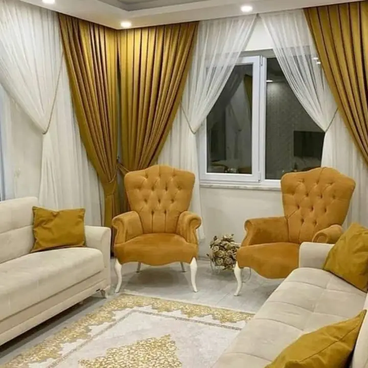 Elegant living room with gold and white layered curtains