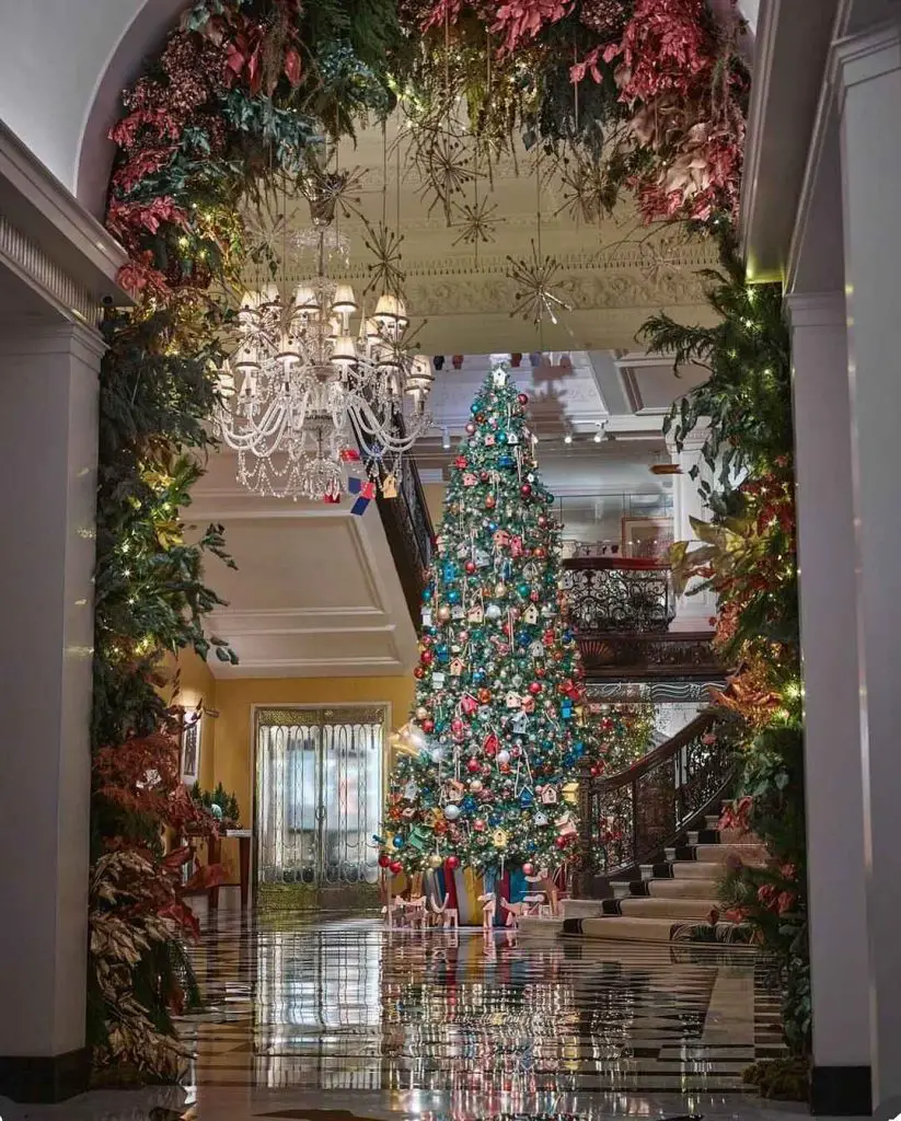 Grand foyer decorated for Christmas with a large tree and garlands