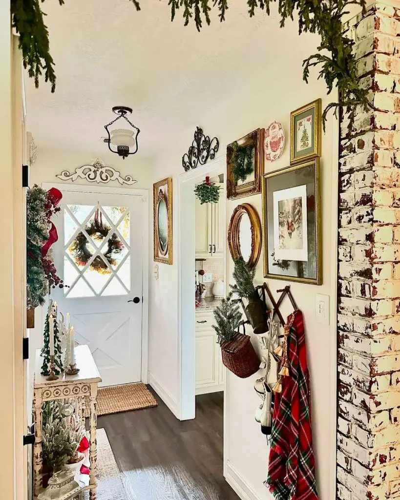 Inviting hallway decorated for Christmas with a front door and greenery.