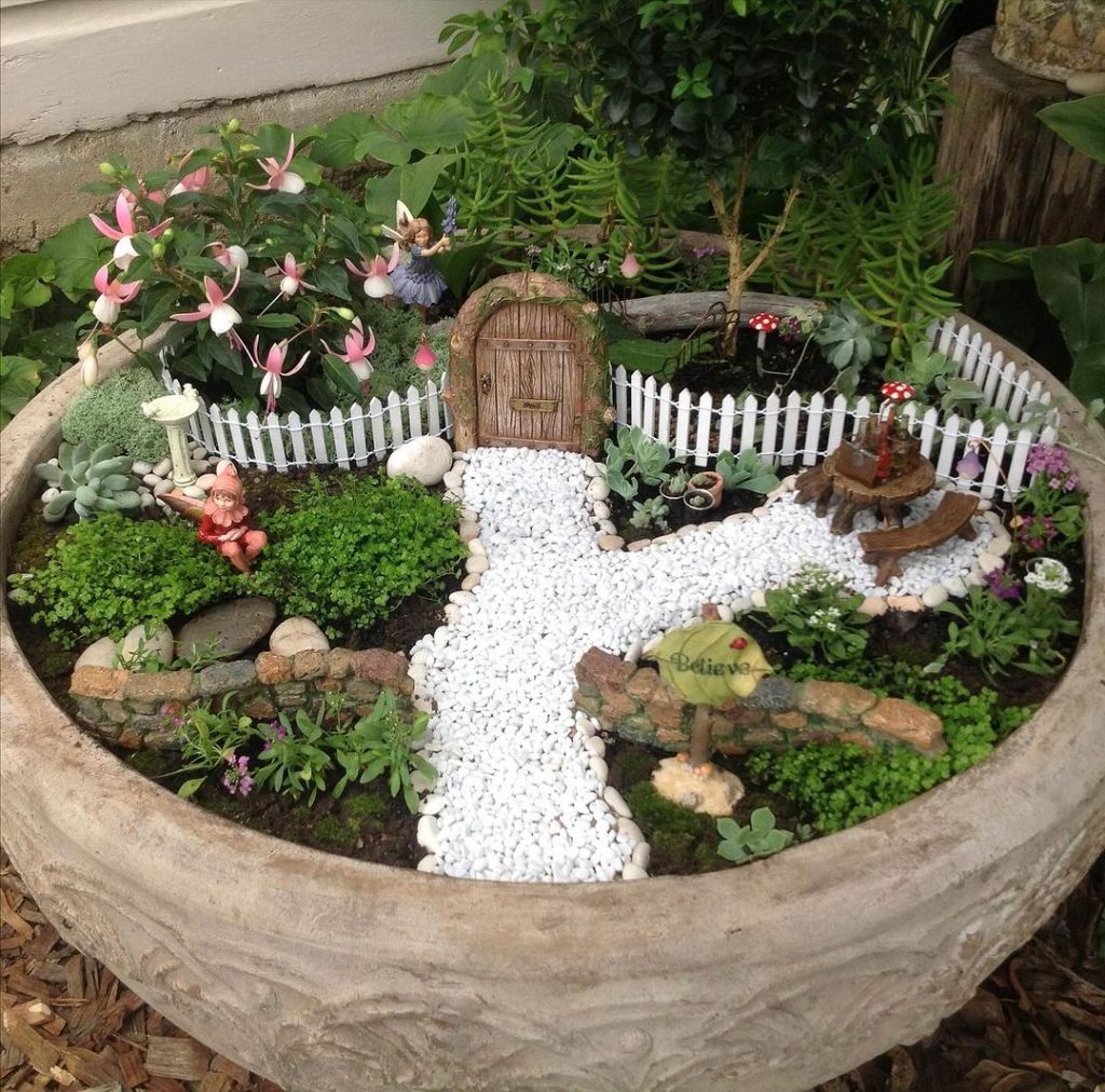 Fairy garden with miniature door and flowers