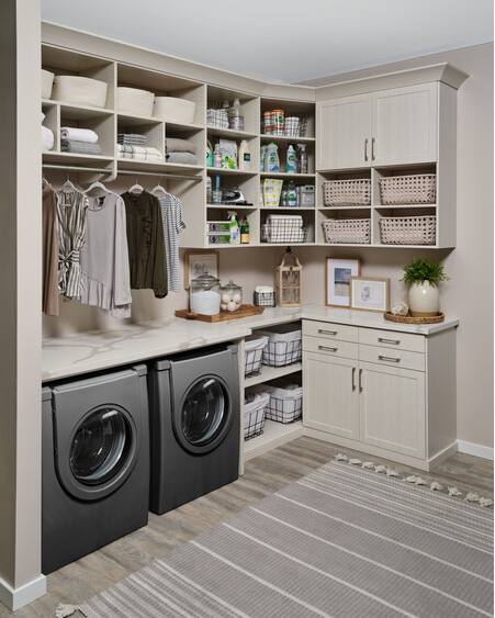 L-shaped laundry room with built-in storage solutions