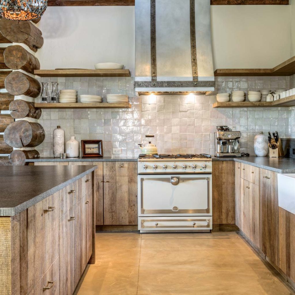 Modern rustic kitchen with wooden cabinets, tile backsplash, and a vintage range.