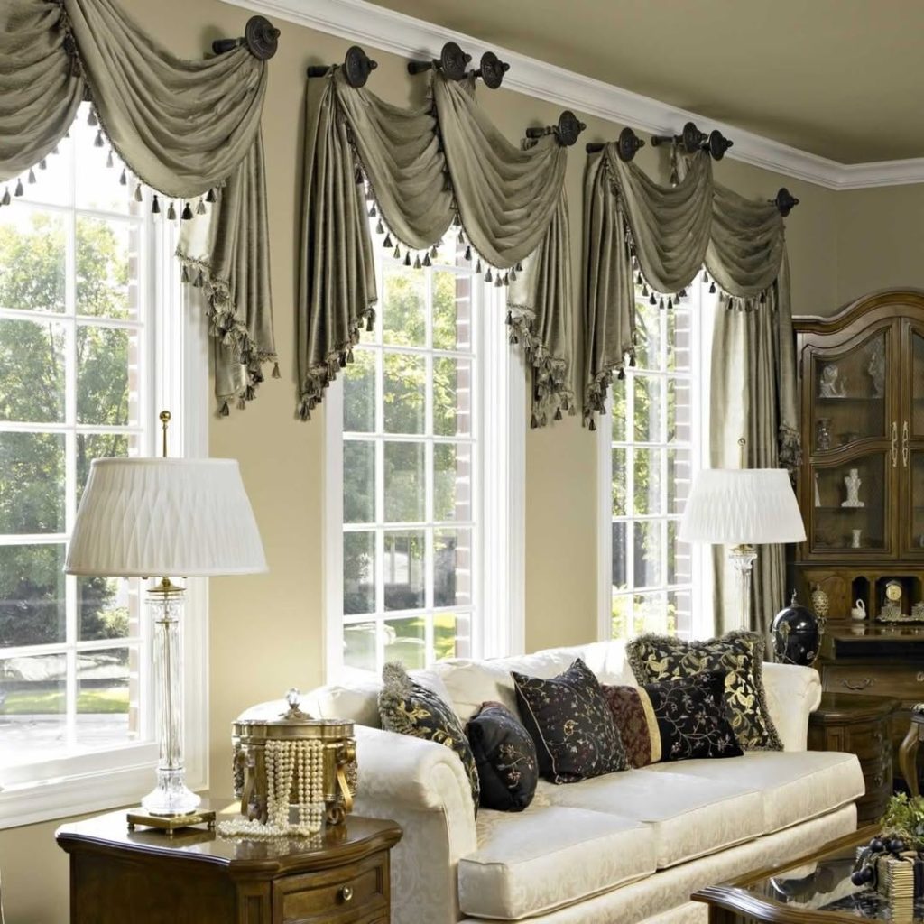 Elegant living room with sage swag curtains and tassels