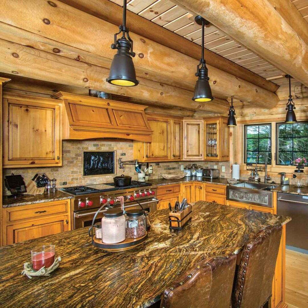 Rustic log cabin kitchen with wooden cabinets and granite island