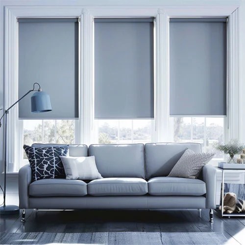 Modern gray roller shades in living room.