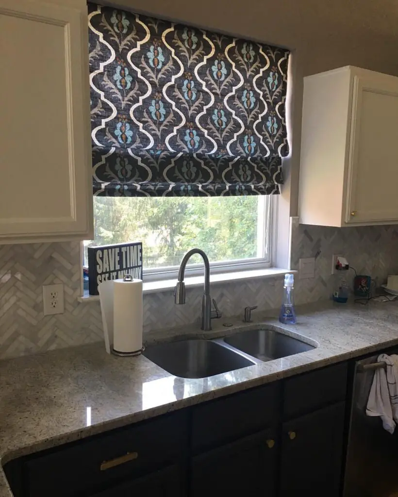 Modern kitchen with patterned window treatment and granite countertop