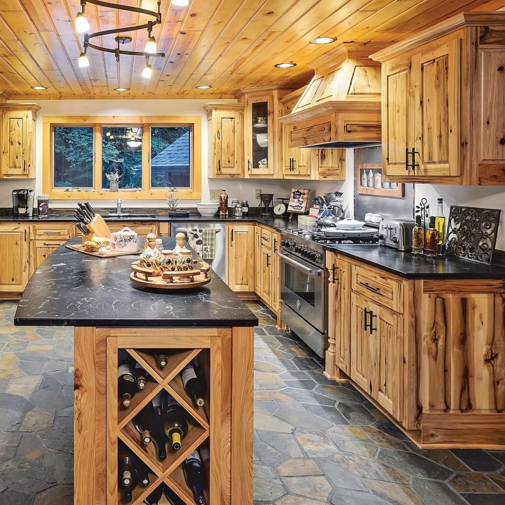 Rustic kitchen with wooden cabinets and black countertop