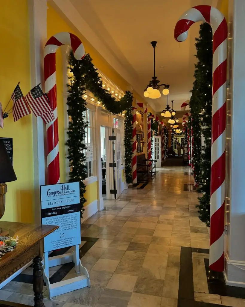 Whimsical hallway decorated with candy canes and greenery.