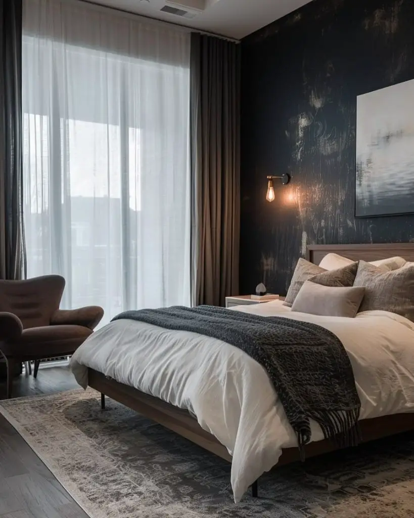 Navy bedroom with wooden sleigh bed and elegant crystal chandelier