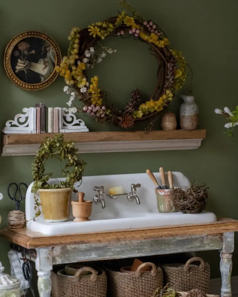 Vintage bathroom with green clawfoot tub and crystal chandelier