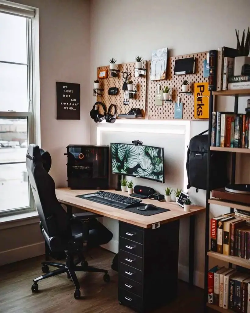 Modern gaming desk setup with pegboard organizer and black gaming chair