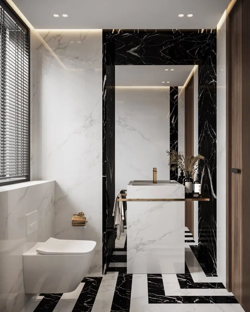 Modern bathroom with striped black and white marble floor and freestanding sink