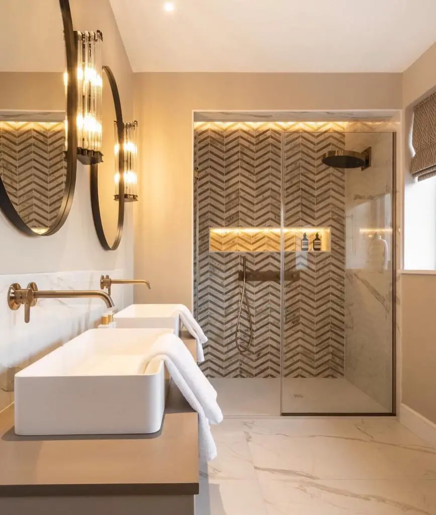 Teal bathroom with checkered tiles brass fixtures and wall art