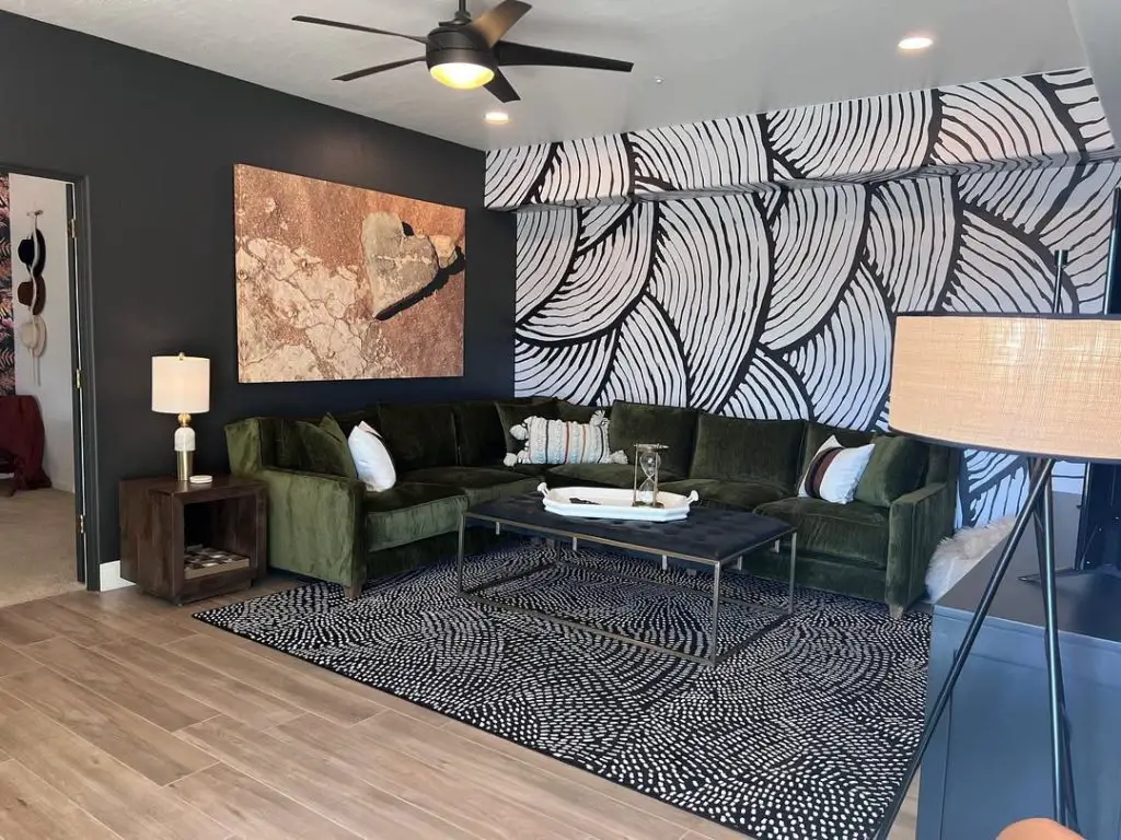 Living room with built in bookshelves fireplace and matching grey chairs