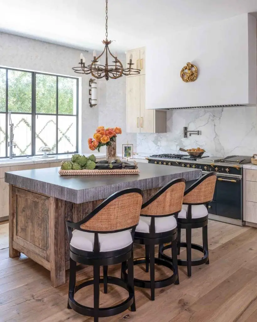White farmhouse kitchen with stone walls and floating wooden shelves