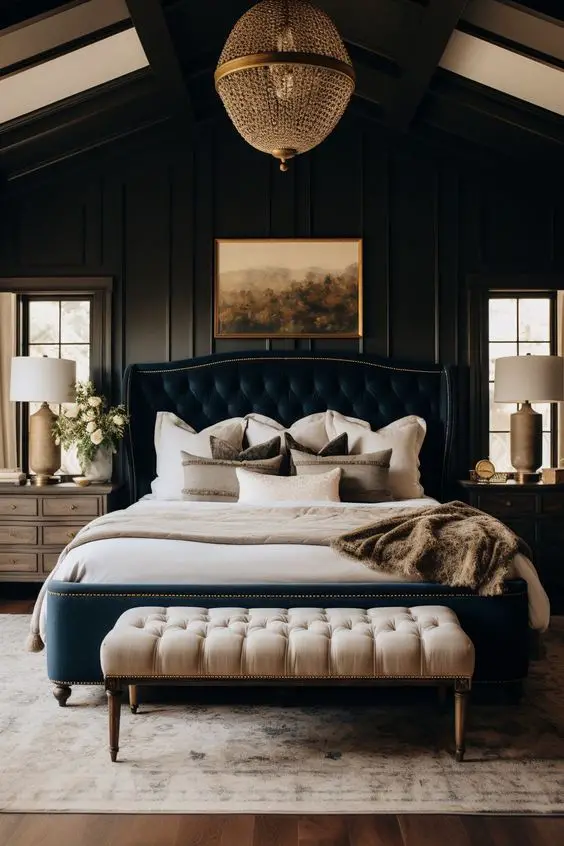 Dark bedroom with crystal chandelier tufted headboard and elegant decor