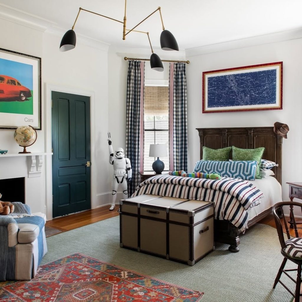 Boys bedroom with space theme striped bedding and vintage car art
