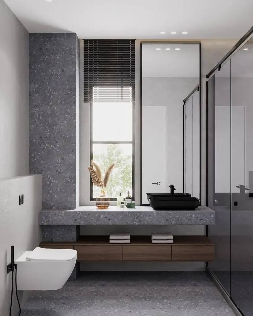 Contemporary bathroom with concrete countertop and black vessel sink