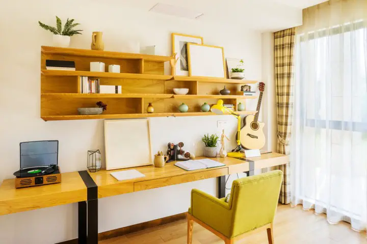 Small office space in attic with red window frames