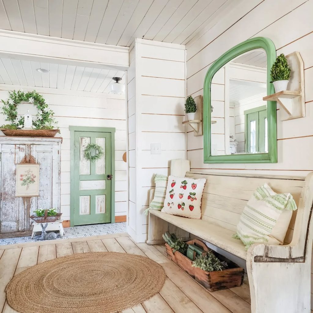 White entryway with green accents and butterfly wall decor