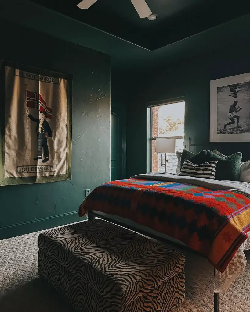 Dark green bedroom with leather bed vintage posters mountain decor