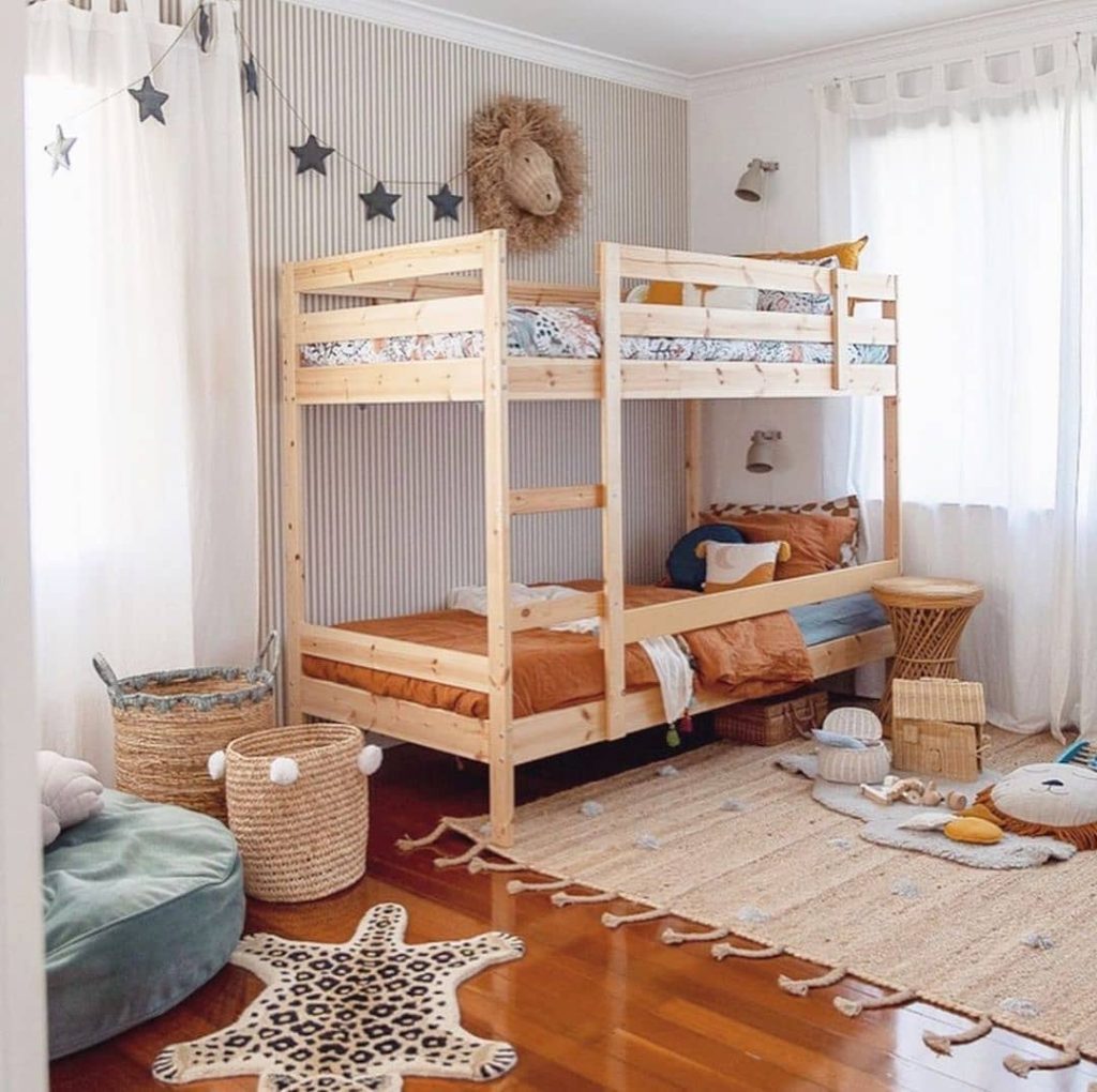 Teen bedroom with blue geometric wall and skateboard decor