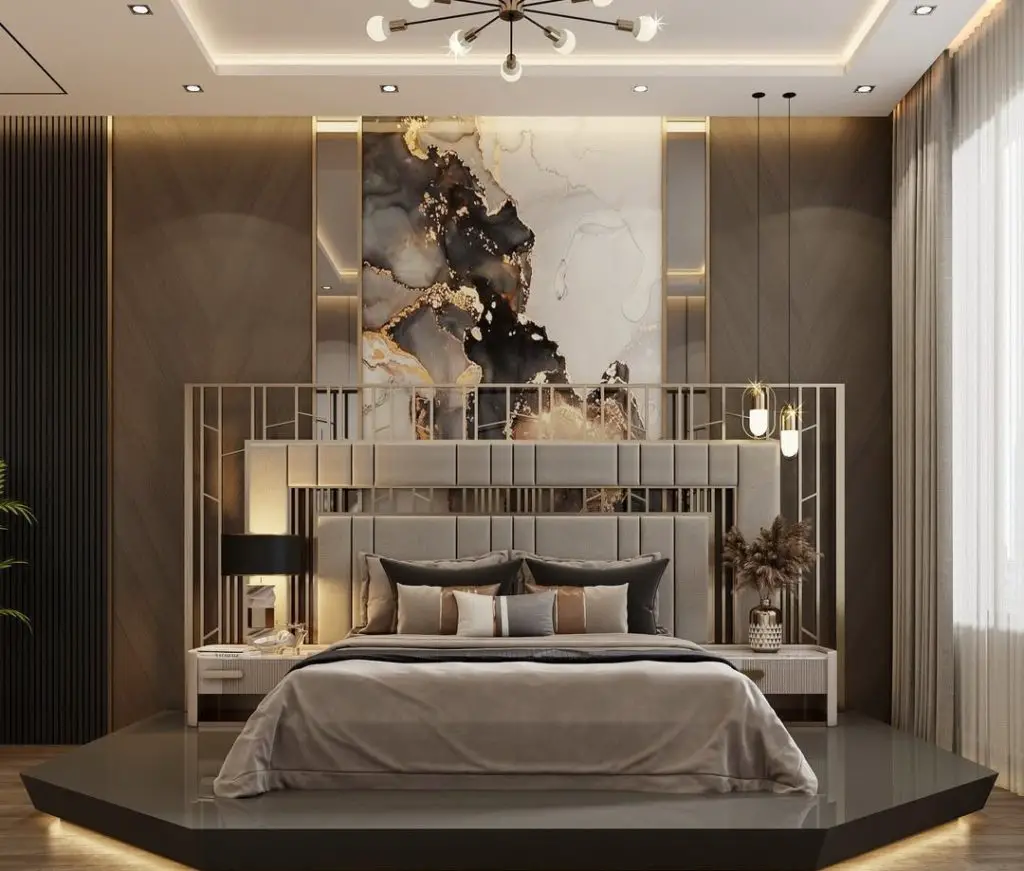Modern luxury bedroom with large marble effect artwork and brass accents