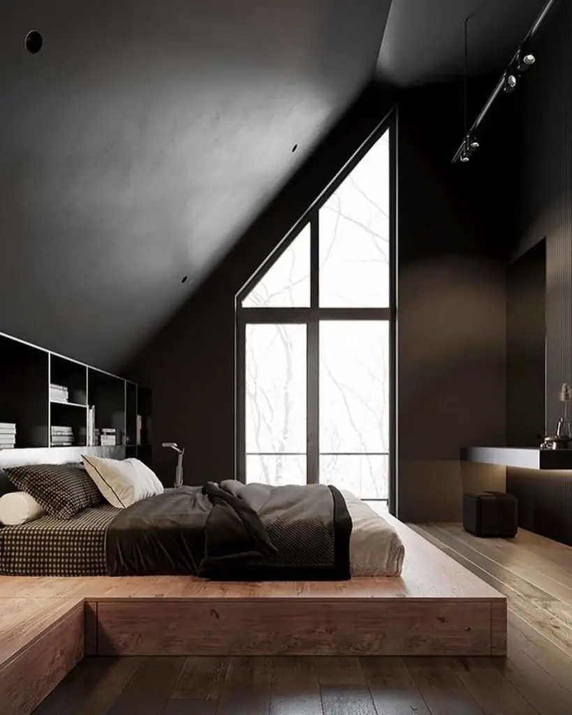 Dark industrial bedroom with vintage decor and exposed brick walls