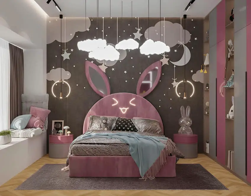 Pink bunny-themed bed with cloud wall murals and hanging pendant lights