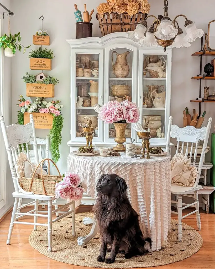 White dining room with herb box wall display and vintage cabinet