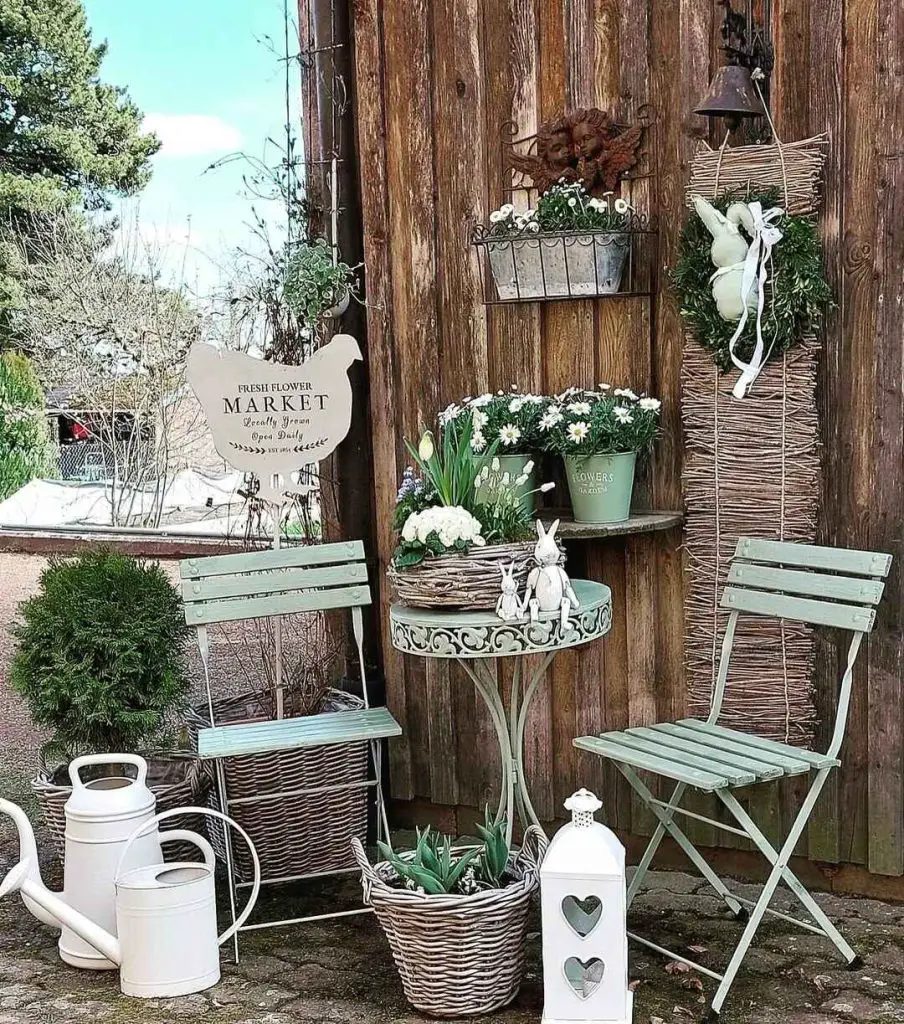 Rustic garden display with mint chairs and flower market sign