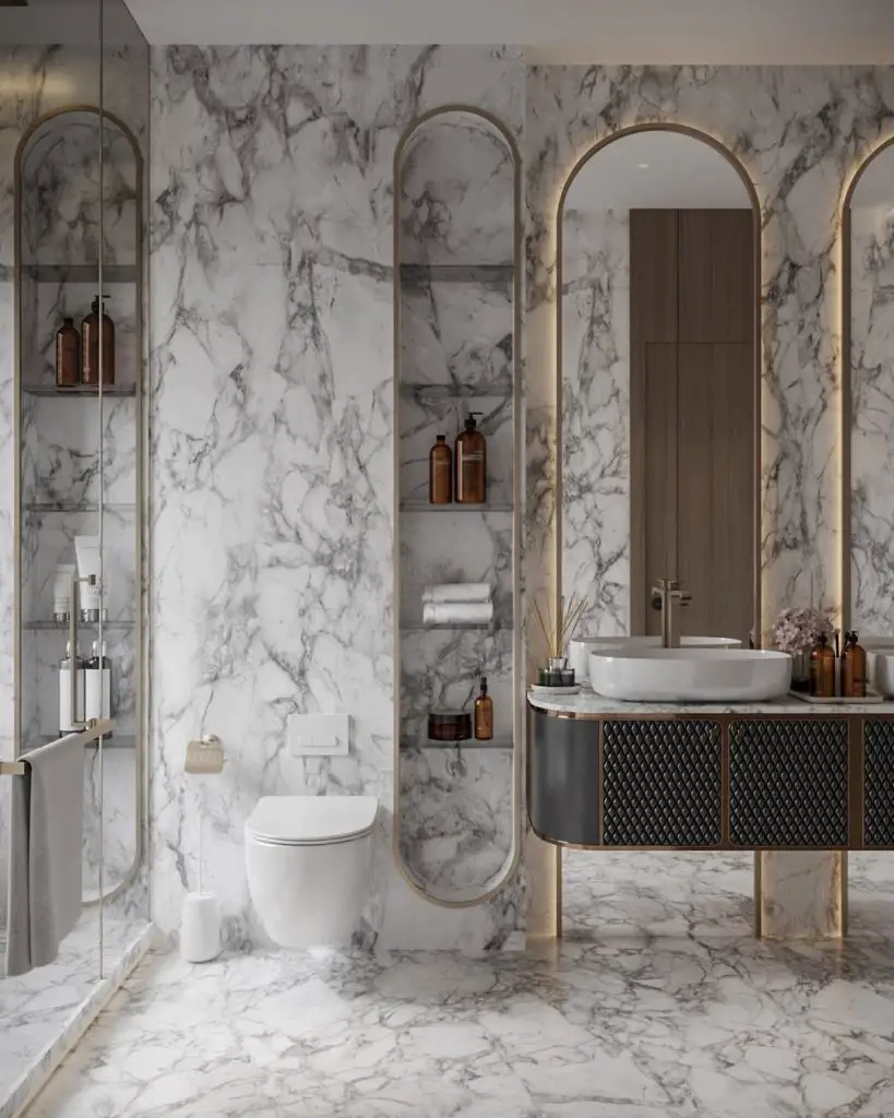 Luxury bathroom with marble walls and golden arched frames