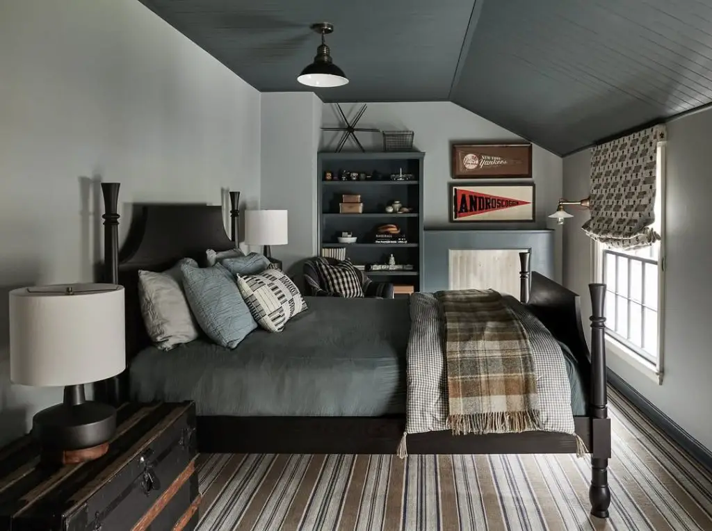 Attic bedroom with built in shelves vintage car decor and window seat