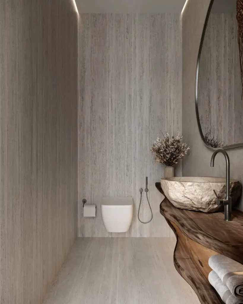 Modern bathroom with stone walls and natural wood vanity
