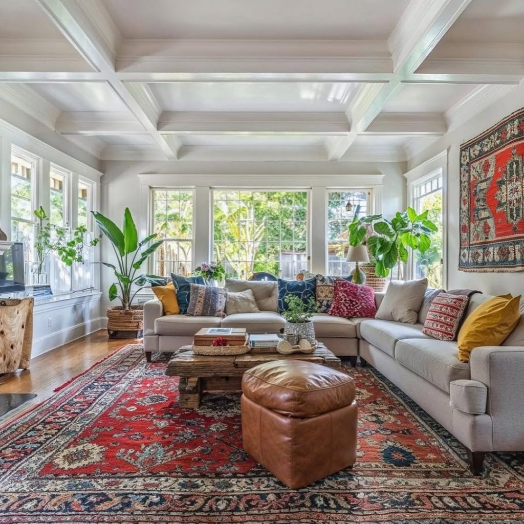Minimalist living room with green couch plants and natural decor
