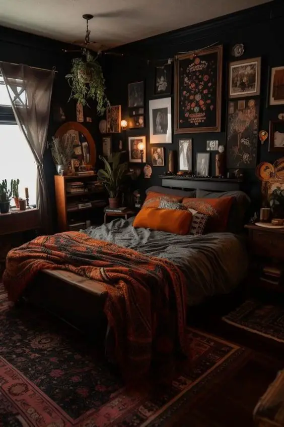 Dark bedroom with gallery wall orange bedding and hanging plants
