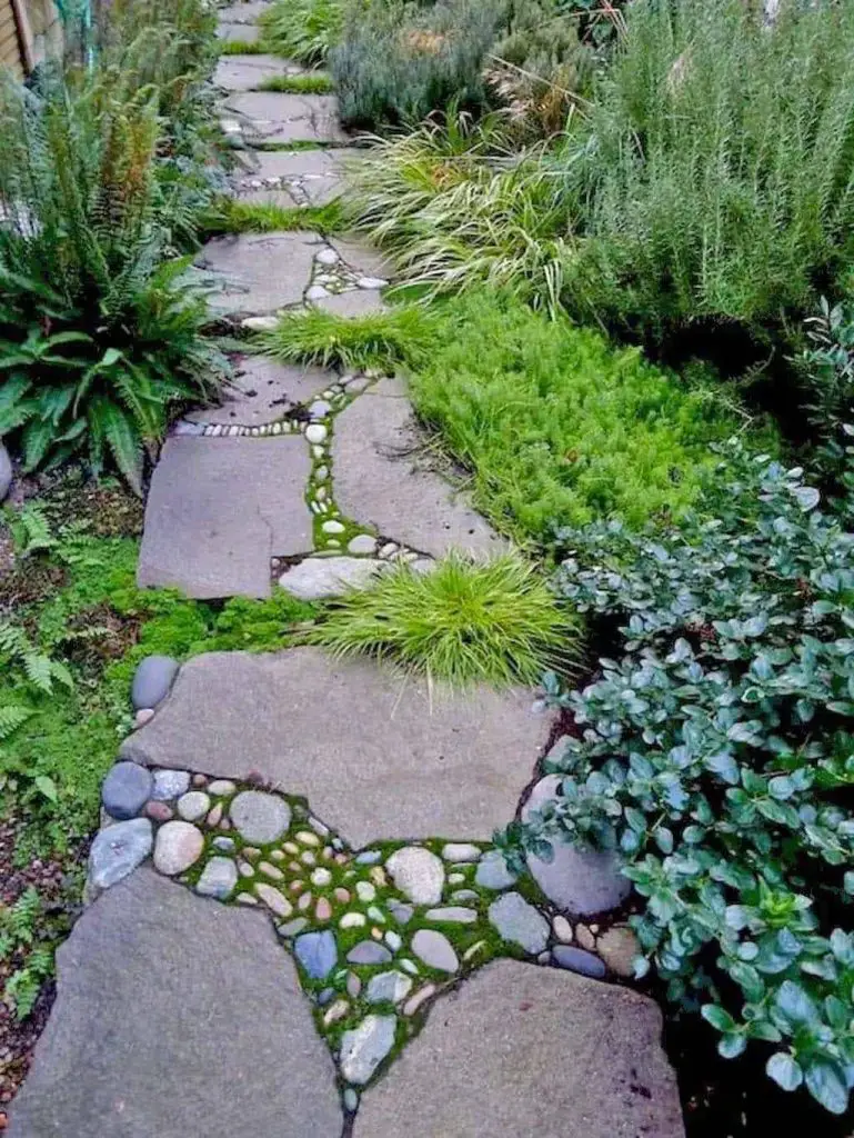 Garden path with river rocks and pavers creating flowing pattern