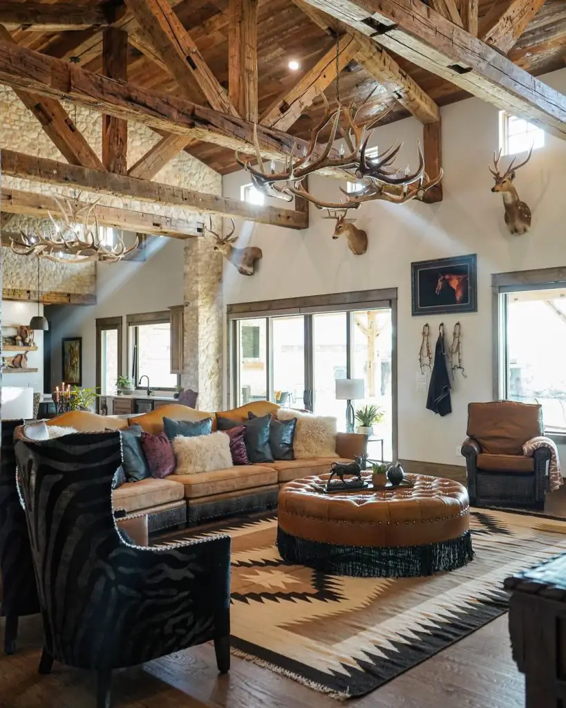 Modern living room with windmill ceiling fan stone fireplace and colorful accents