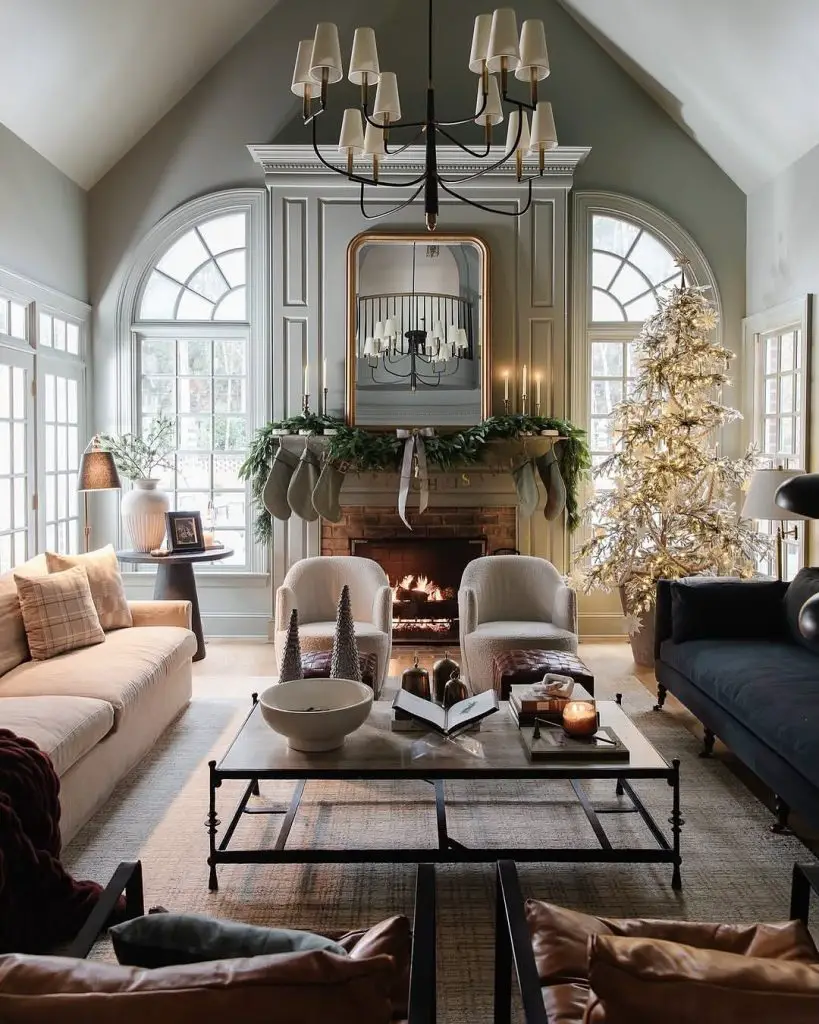 Elegant living room with cathedral ceiling holiday decor and illuminated Christmas tree
