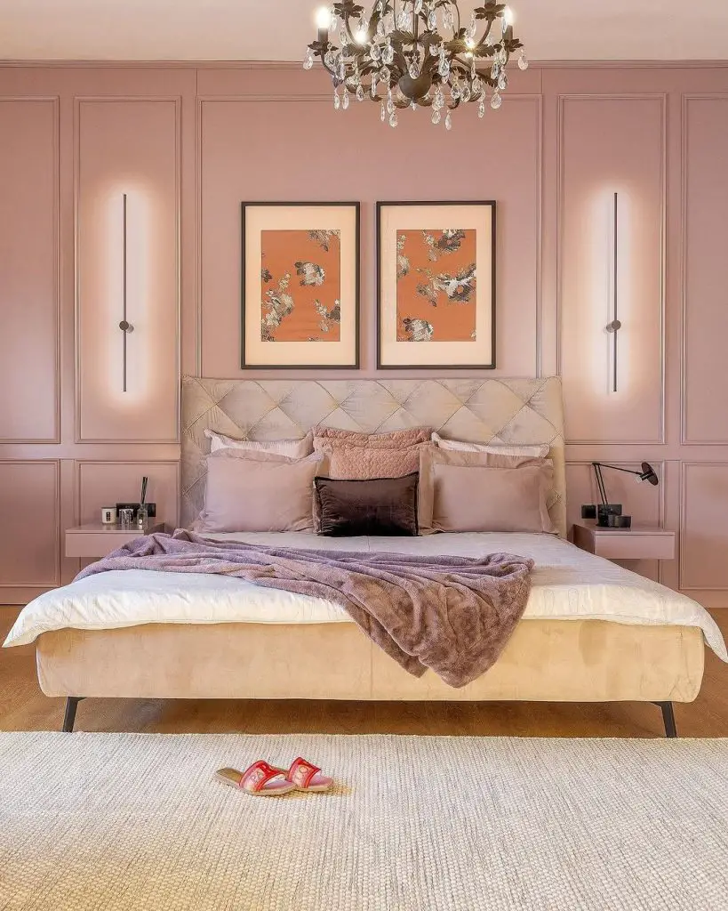 Twin bed hotel style room with pink headboards and pendant lights