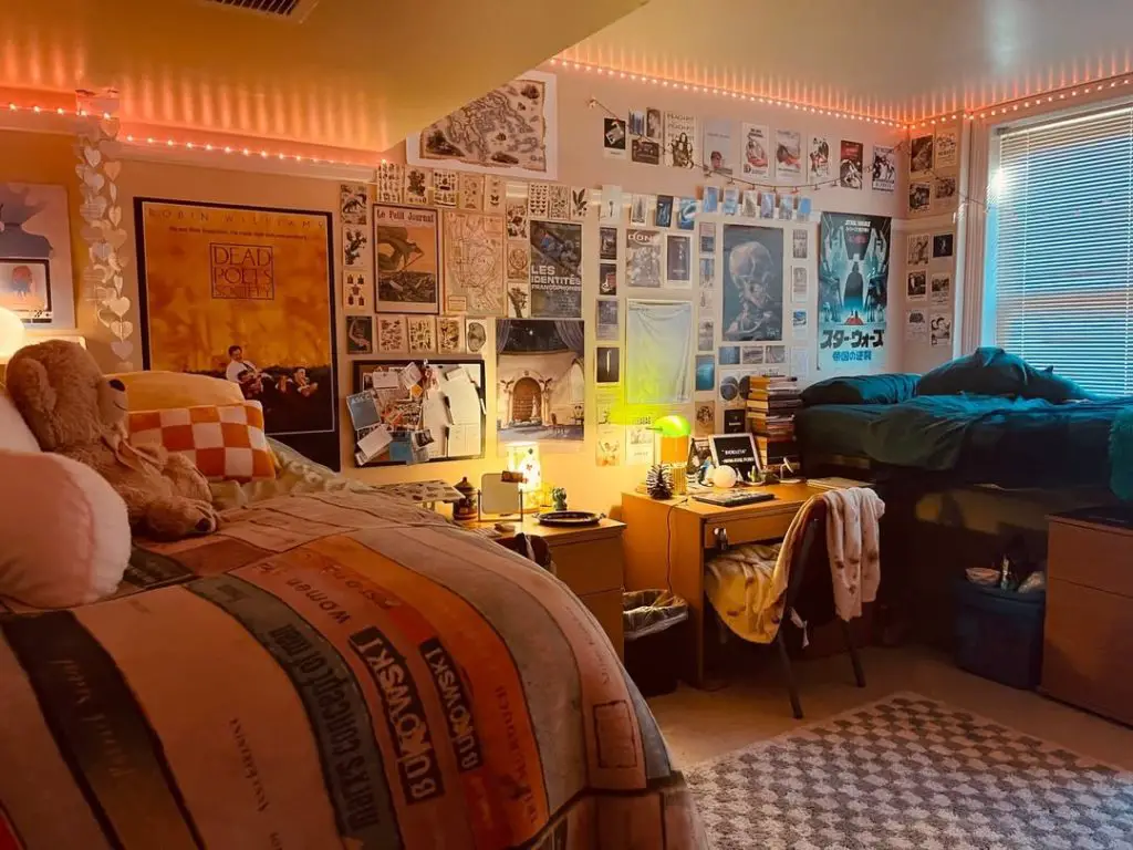 Modern dorm room with sports posters and white furniture setup