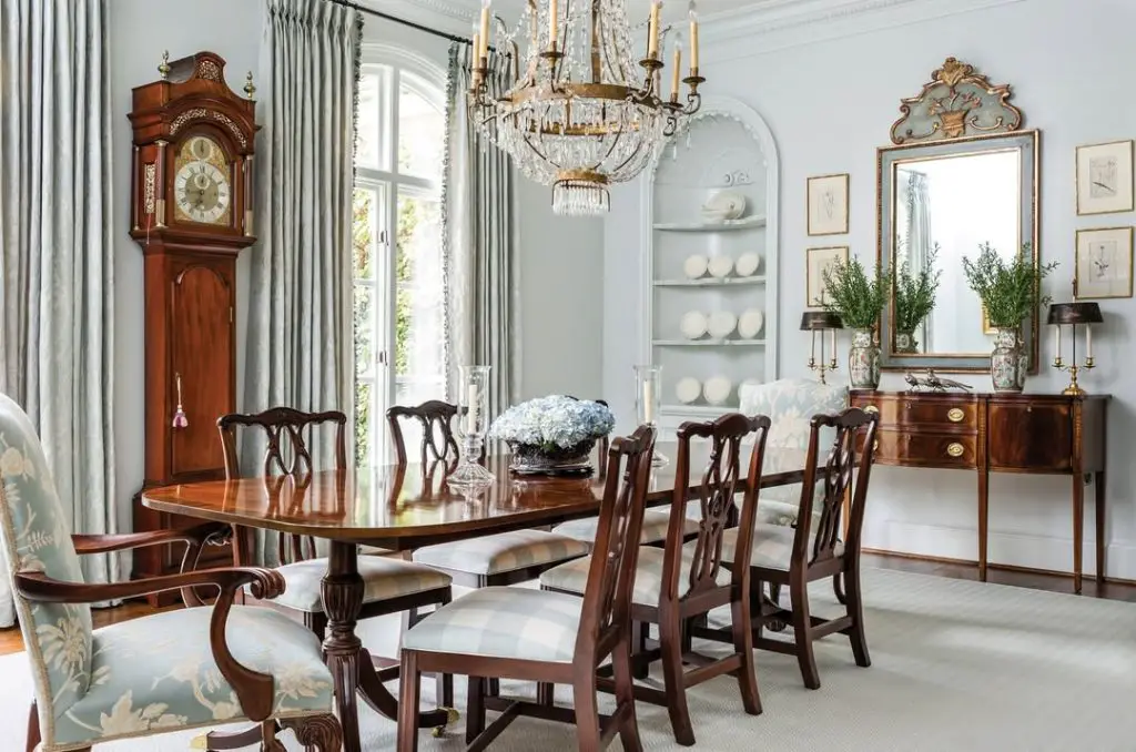 Formal dining room with crystal chandelier and mahogany furniture