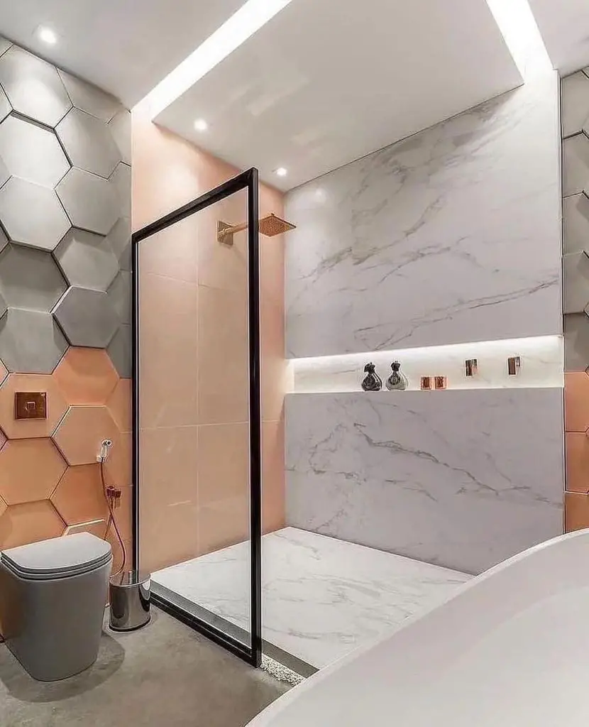 Modern bathroom with pink hexagonal tiles and black frame shower